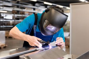 Mobile welder repairing metalwork on-site in Hillington